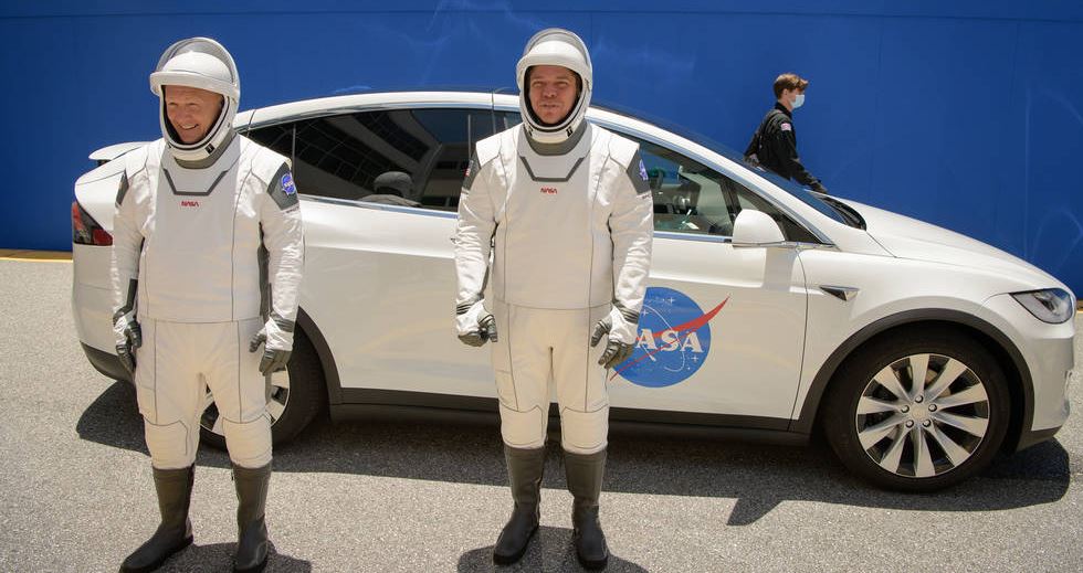 NASA astronauts Douglas Hurley, left, and Robert Behnken, wearing SpaceX spacesuits, are seen as they depart the Neil A. Armstrong Operations and Checkout Building for Launch Complex 39A during a dress rehearsal prior to the Demo-2 mission launch, Saturday, May 23, 2020.
Credits: NASA/ Bill Ingalls